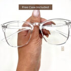 A person holding up a pair of Blue Light Blocking Photochromic Glasses- Clear with the words free case included.