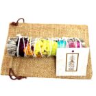 A bundle of 4" California White Sage Smudge Sticks with 7 Chakra Colored, perfect for home fragrance.