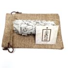 An California organic white sage smudge sticks on a sack.