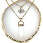 Two White Clear Quartz Natural Stone Necklaces on a gold plate.