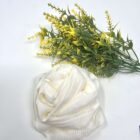 A Rose Loofah- White with yellow flowers next to it.