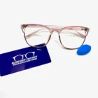 A pair of Blue Light Blocking Photochromic Glasses- Pink and a blue card on a table.