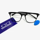 A pair of Blue Light Blocking Photochromic Transition glasses- Black with a blue tag on them.