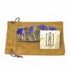 A California White Sage Smudge Sticks with Purple Sinuata Flowers pouch containing white sage and lavender, complete with a tag attached.