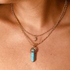 A woman adorned with a Turquoise with Moon Charm Natural Stone Necklace.