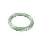 A green Jade Bangle Bracelet on a white background.