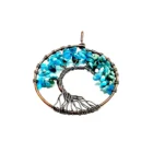 An Apatite Tree of Life Pendant is hanging from a copper wire.