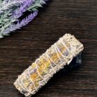 A California White Sage Smudge Sticks with Lavender on a wooden table.