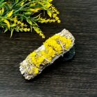 A 4" California White Sage Smudge Sticks with Yellow Sinuata Flowers next to it.