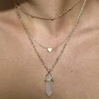 Love's Embrace: Rose Quartz Heart Necklace - A woman wearing a Rose Quartz Heart Necklace.