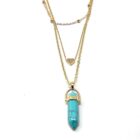 A Turquoise with Heart Charm Natural Stone Necklace adorned with a mesmerizing turquoise stone and a heart shaped pendant.