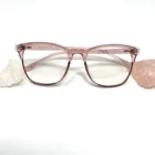 A pair of Blue Light Blocking Photochromic Glasses- Pink on a white background.