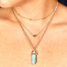 A woman wearing a Turquoise with Heart Charm Natural Stone Necklace | Choker  | Gift | Gift for Her | Healing Necklace | Dainty Necklace birthstone necklace.