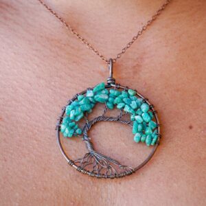 A woman is wearing an Amazonite Tree of Life Pendant.