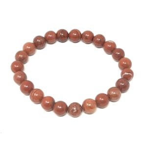 A Red Jasper Gemstone Bracelet adorned with Red Jasper beads on a white background.