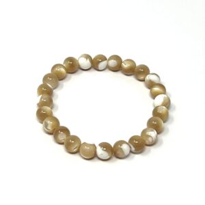 A khaki and white bead bracelet with Khaki Mother of Pearl Gemstone accents on a white surface.