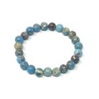 A Blue Sea Sediment Jasper Gemstone Bracelet gemstone bracelet with blue and brown stones.