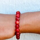 A Matte Dream Agate gemstone bracelet on a woman's wrist.