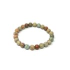 An Aqua Terra (Serpentine) gemstone bracelet made of brown, green, and blue stones.