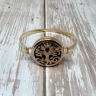 A Positive Vibes Diffuser Bracelet adorned with a beautiful tree of life symbol, exuding positive vibes.