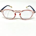 A pair of Blue Light Blocking Photochromic Glasses Round Circle Lenses - Pink/ Blue & Cream on a white surface.