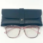 A pair of Blue Light Blocking Photochromic Glasses- Pink with a black case.