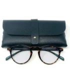 A pair of Blue Light Blocking Photochromic Glasses Round Circle Lenses reading glasses with a leather case.