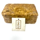 A block of African Black Soap with a tag on it.