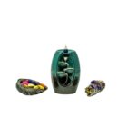 A Small Ceramic Waterfall Backflow Incense Burner with Mixed Incense Cones accompanied by a bowl of colorful beads.