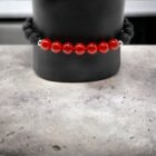 A Gemstone Crystal Bracelet, Carnelian, Lava, Stainless Steel 6mm on a mannequin.