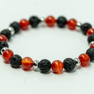 A red Gemstone Crystal Bracelet with black lava beads.